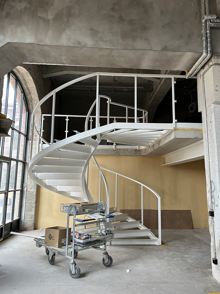 Escape staircase entrance packing chamber in detail at Postbahnhof Berlin.
